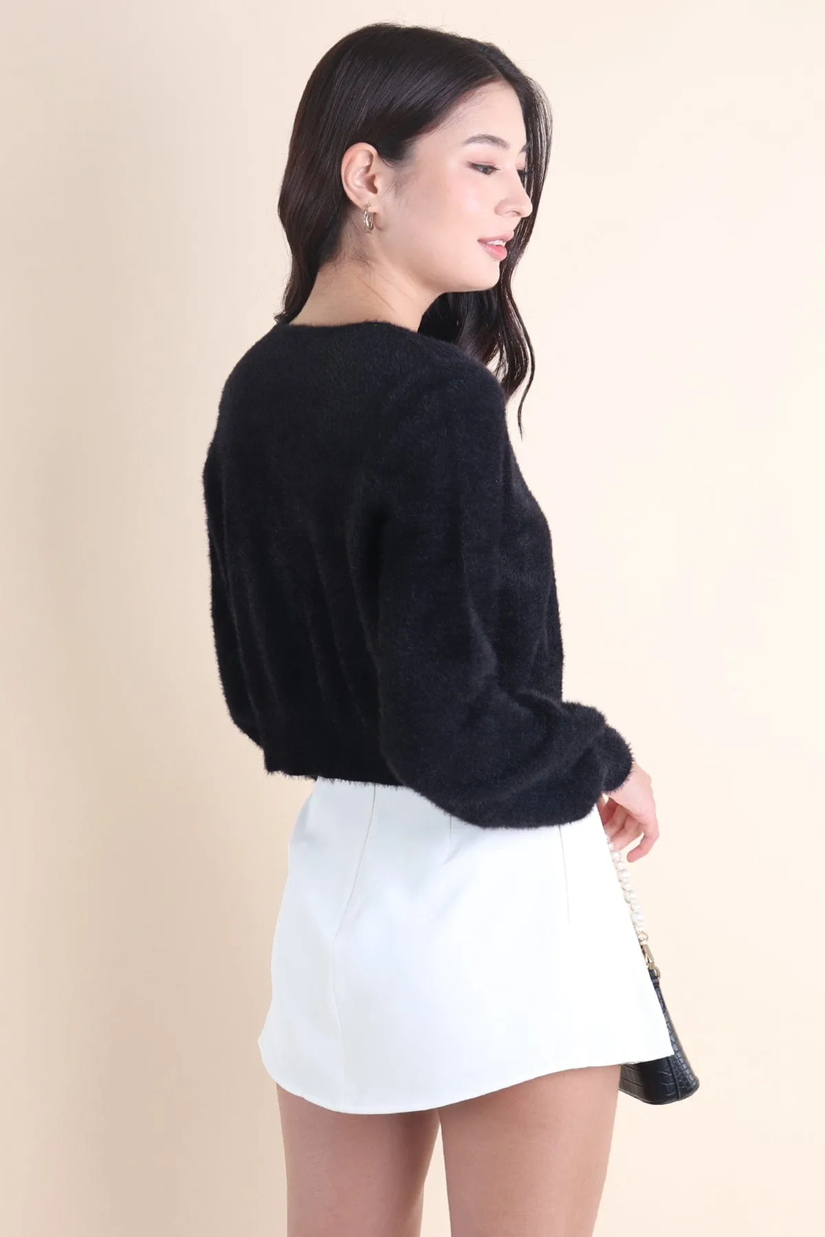 ELIZ BOW FURRY CARDIGAN IN BLACK